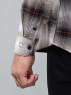 close up shot of the cuff sleeve of the crimson (red) ombre checkered shirt