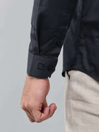 close up shot of the cuff sleeve of the luxe satin charcoal grey shirt